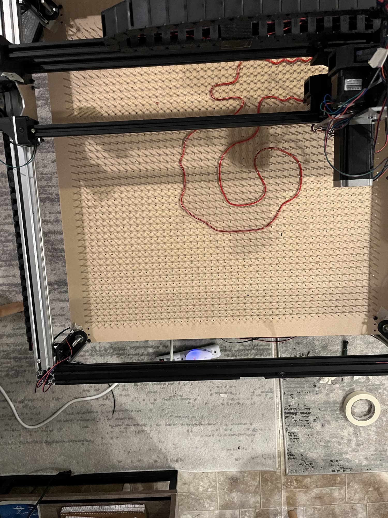Wire laid across the pegboard